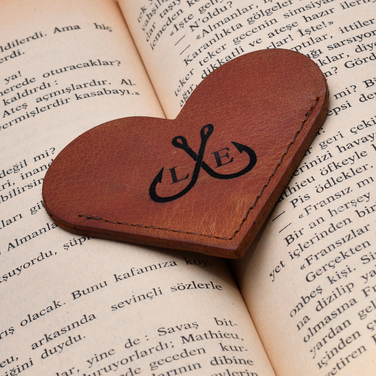 Engraved heart bookmark on a book