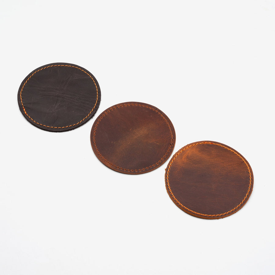 Round leather coasters in three colors