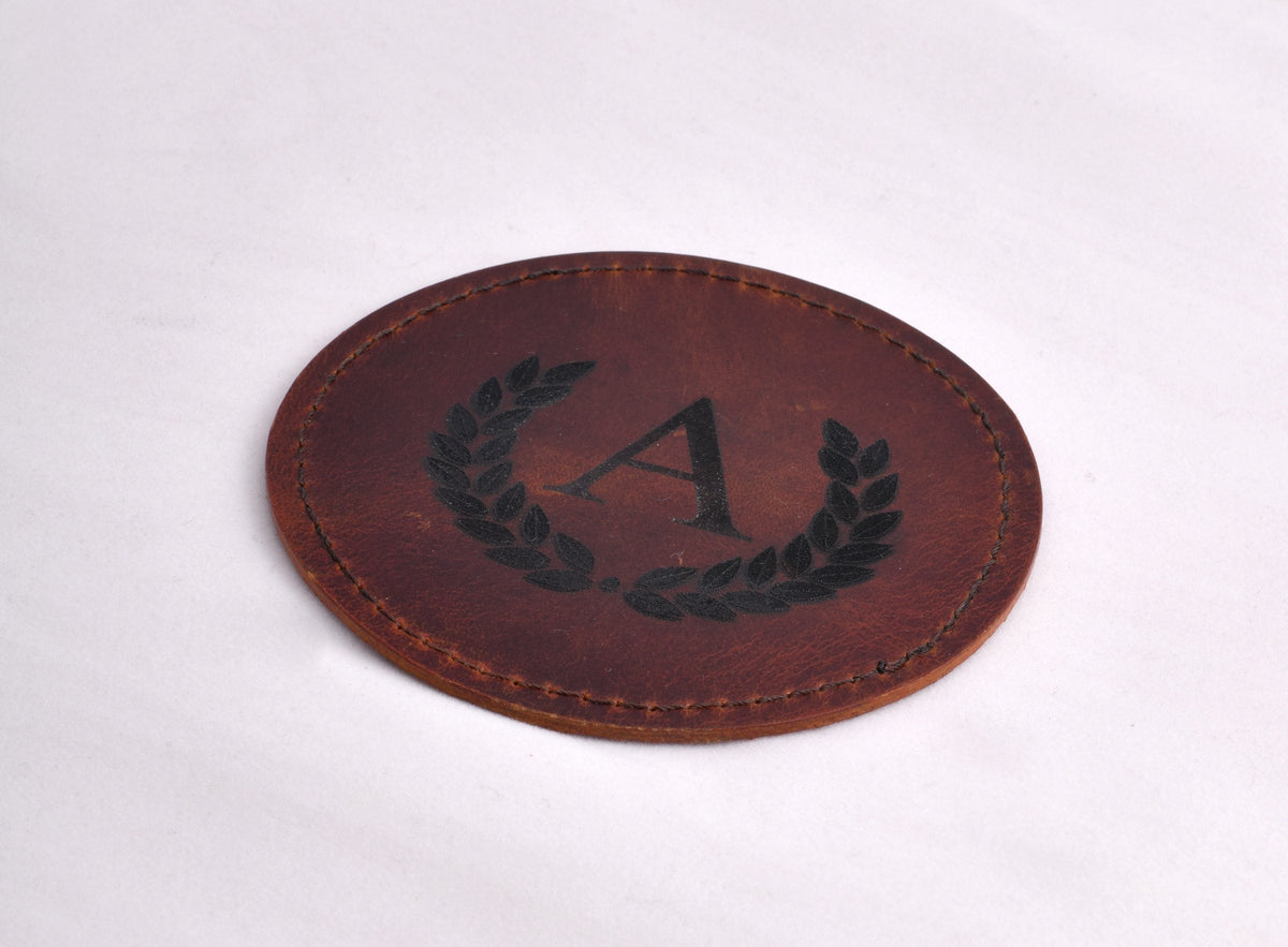 Coaster with engraved monogram