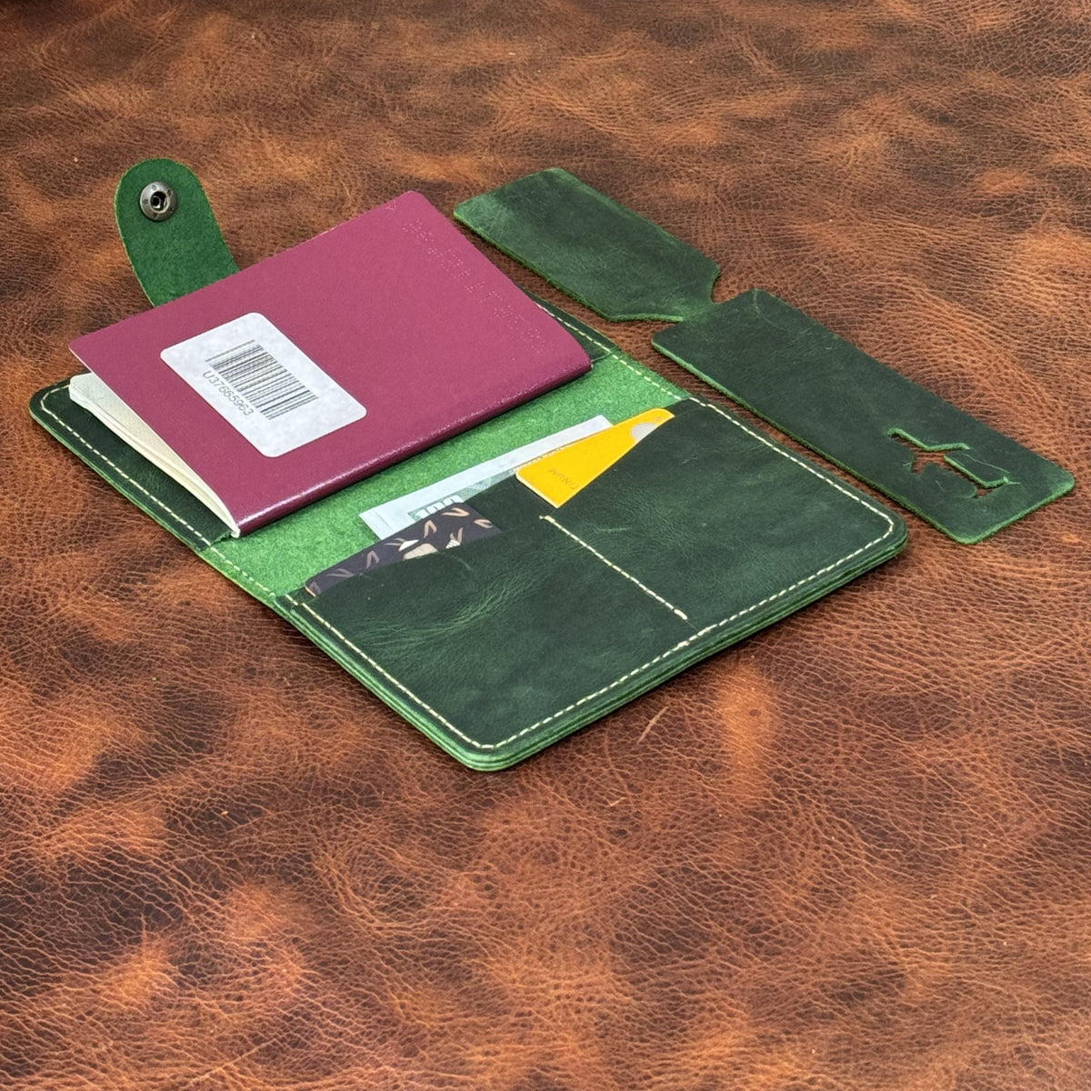 Green passport holder open with passport