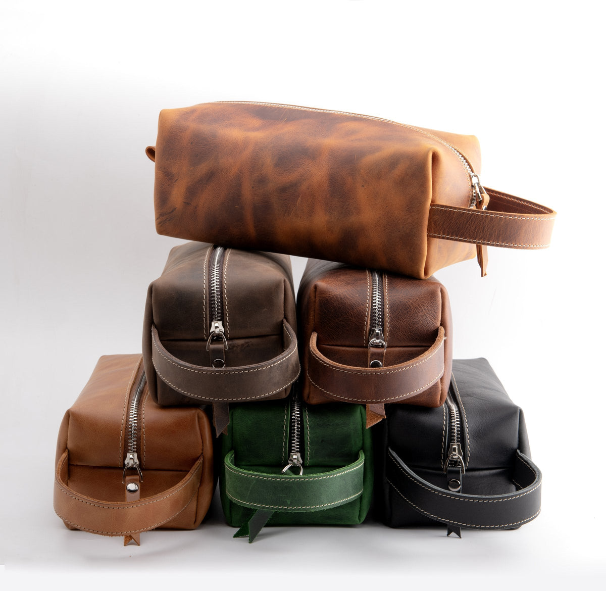 Stack of leather dopp kits